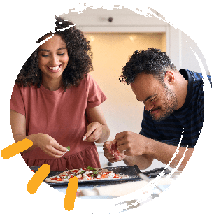 Woman and man with learning disability cooking together